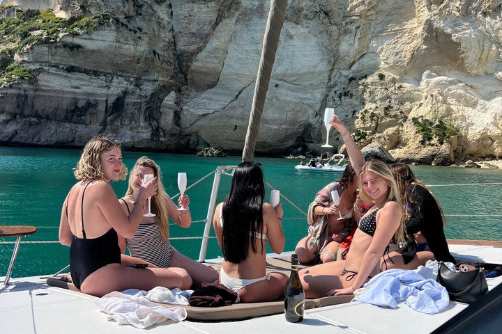 Catamaran tour stops bathing and snorkeling toast with prosecco