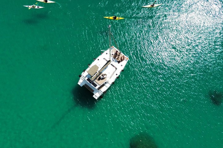 Catamaran tour stops bathing and snorkeling toast with prosecco