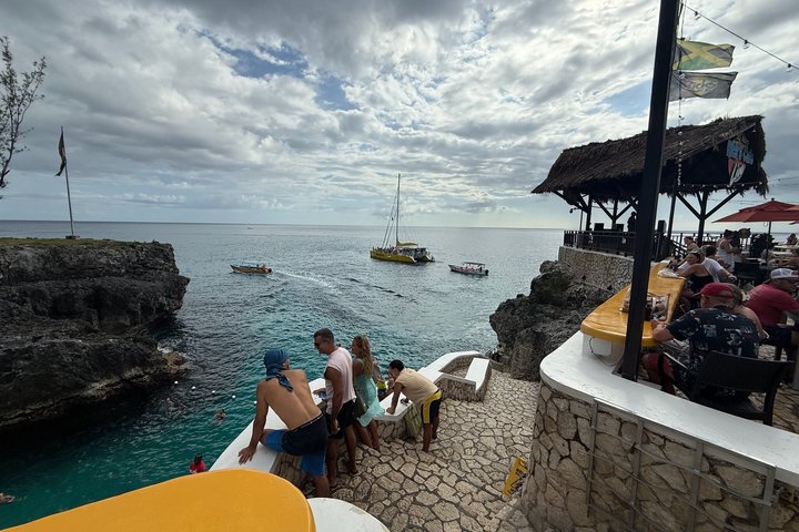 Bamboo Rafting, Catamaran Party Cruise and Ricks Cafe