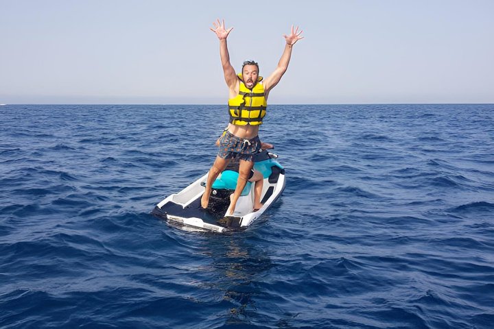 A day at sea in Cala Blanca with paella and jet ski