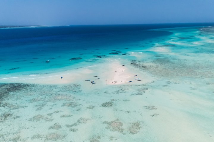 Mnemba Island Luxury Boat Tour with Dolphins and Snorkeling